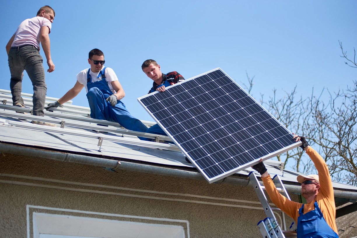 installing-solar-photovoltaic-panel-system-on-roof-2022-05-16-16-02-47-utc