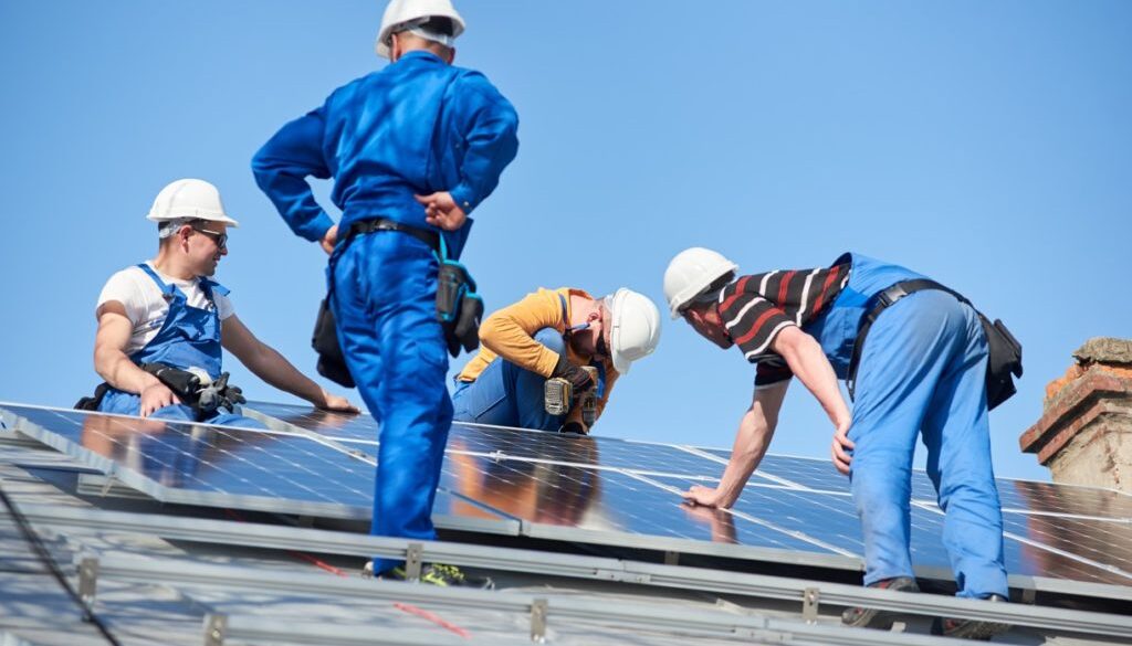 installing-solar-photovoltaic-panel-system-on-roof-2022-05-16-16-04-40-utc