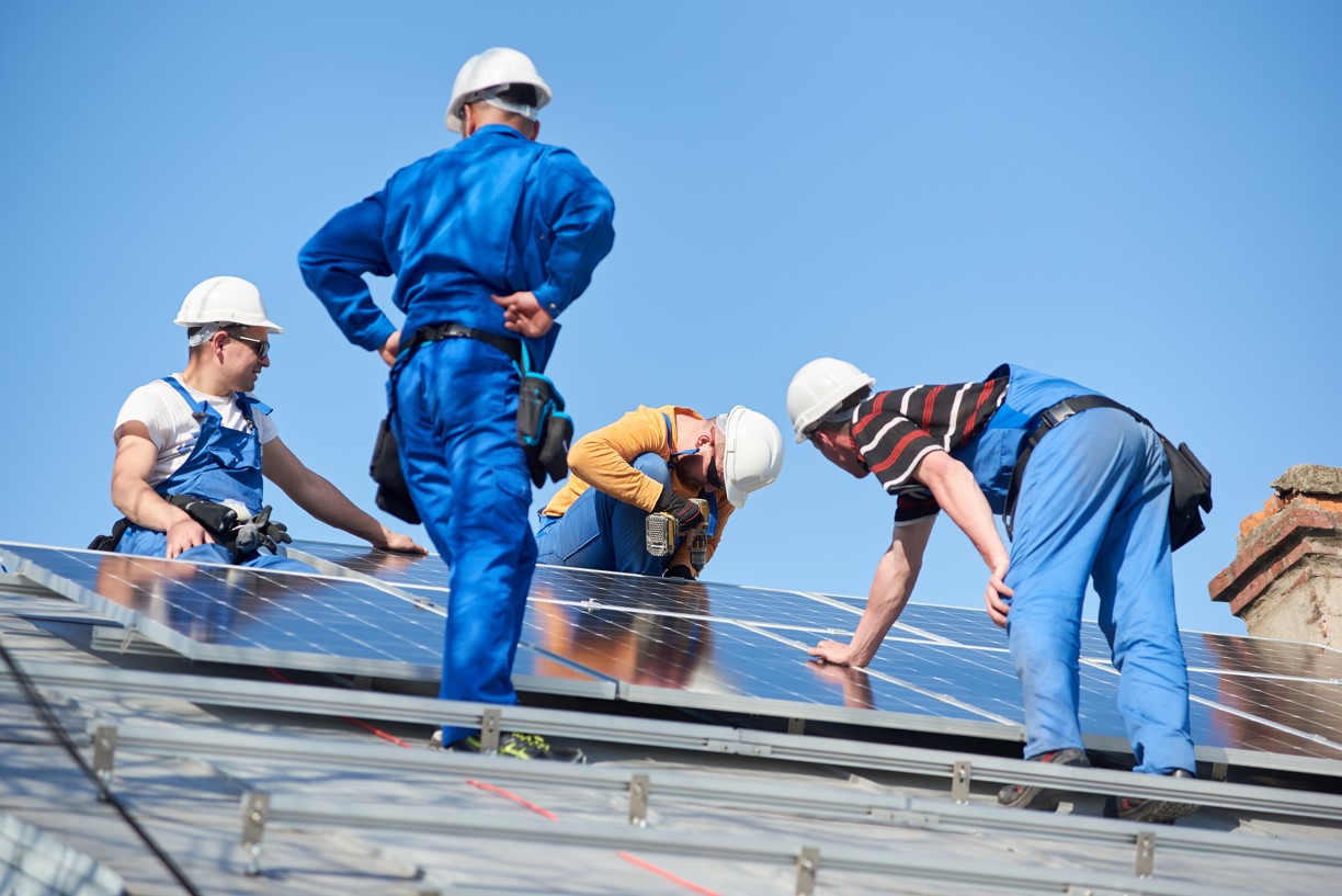 installing-solar-photovoltaic-panel-system-on-roof-2022-05-16-16-04-40-utc