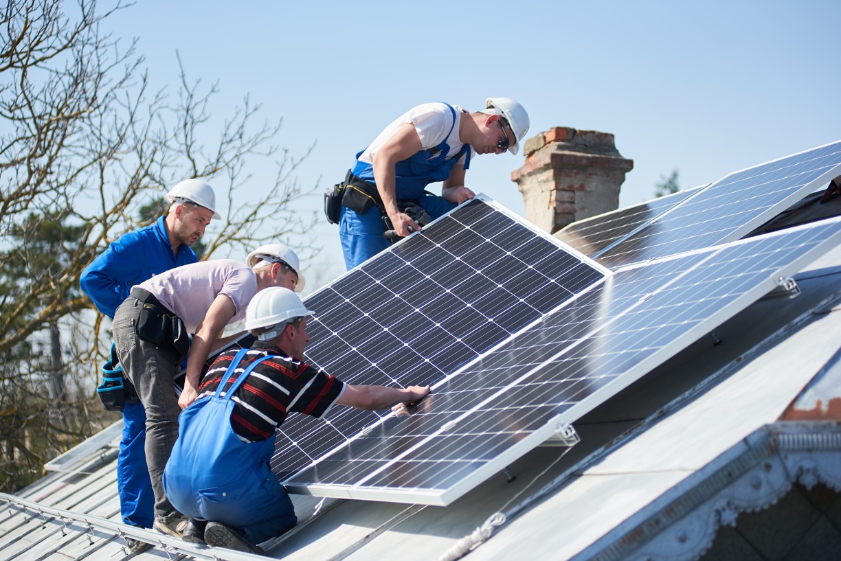 installing-solar-photovoltaic-panel-system-on-roof-2022-05-16-16-05-15-utc