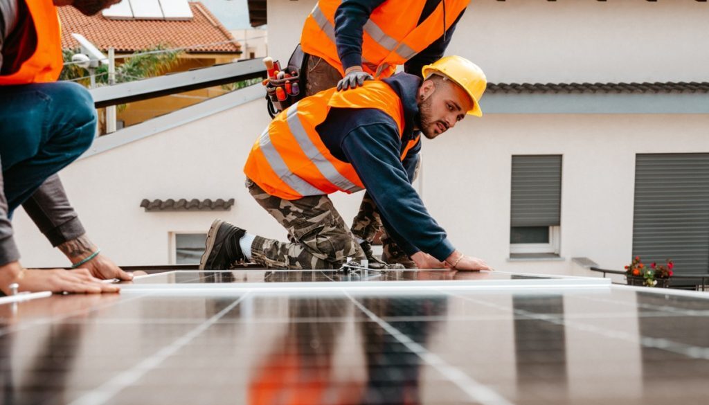 workers-assemble-energy-system-with-solar-panel-fo-2022-07-22-21-57-05-utc
